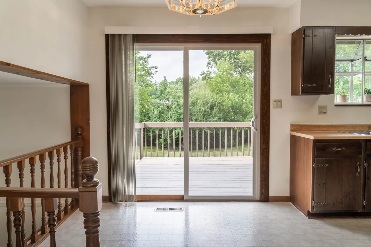 Dining area with a sliding glass door opening onto the rear deck